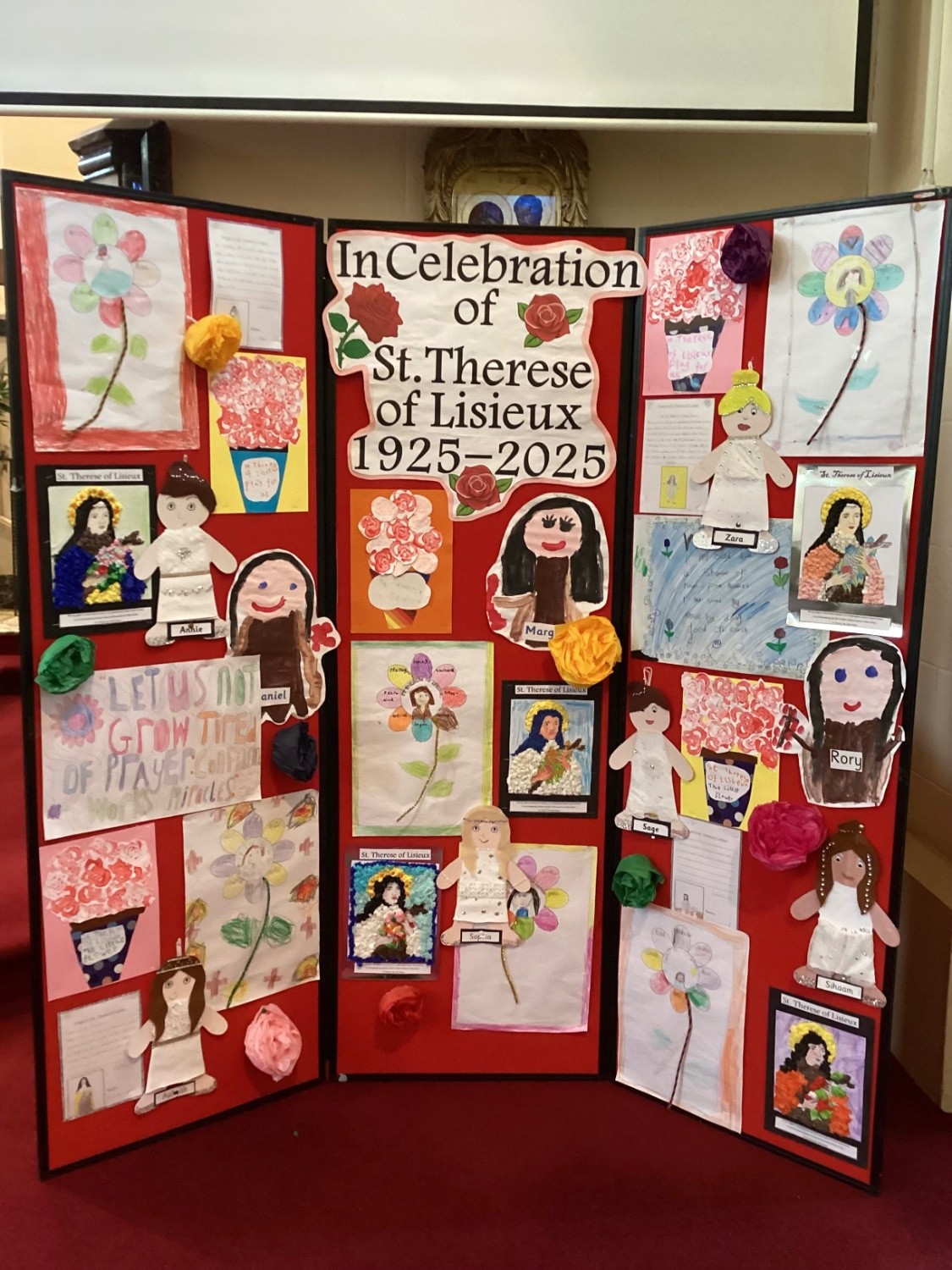 A sample of work created by the children during our week of centenary activities on display in the church.