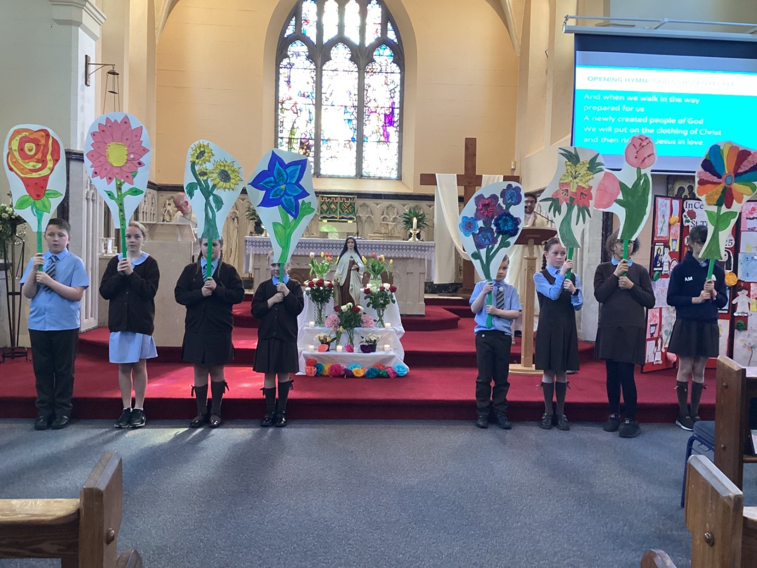 Blessing our large prayer flowers during the ceremony.